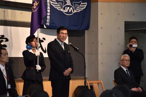 登壇する梅澤理事長の写真
